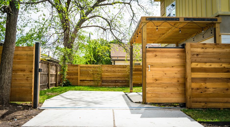 Wood fence and gate in a backyard