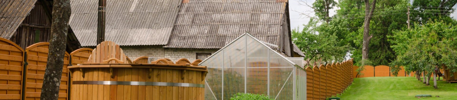 A huge house with ah brown fencing - Turnkey Fences